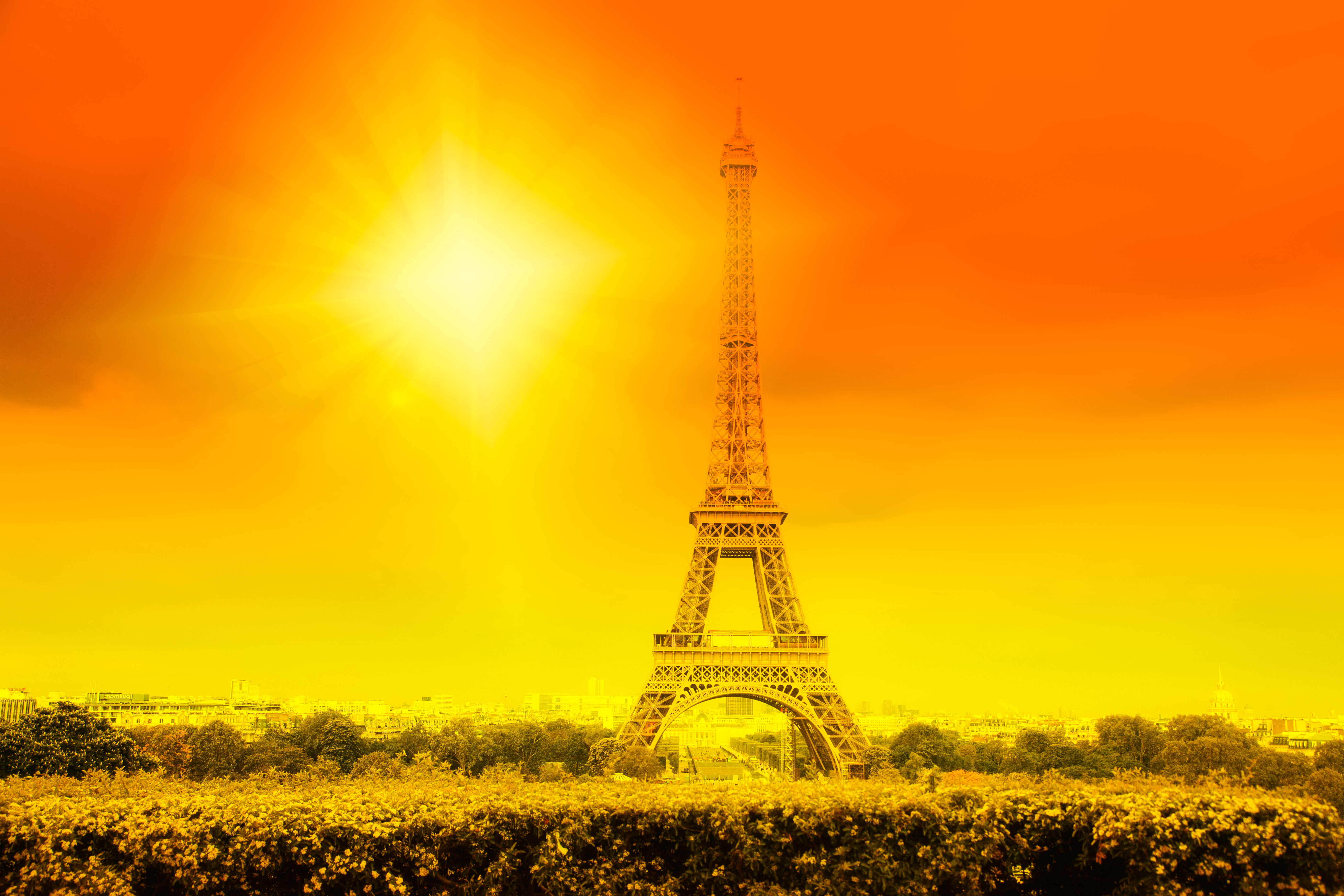 Eiffel tower with sun, heatwave in Paris